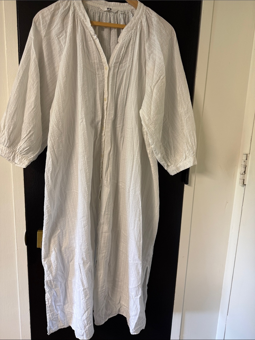 Uniqlo cotton dobe dress features a textured, wrinkled finish and a button-down